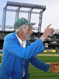 97-year-old Pappy McFreeson, the Mariners' newest pitcher, practices in plainclothes at Safeco Field.  