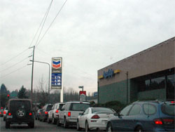 Thousands of motorists waited impatiently in mind-bogglingly long lines Monday for a chance to fill up their cars for the astonishingly low price of $3.80 a gallon. Thousands of motorists waited impatiently in mind-bogglingly long lines Monday for a chance to fill up their cars for the astonishingly low price of $3.80 a gallon.