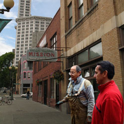 Dino Rossi surveys the imaginary damage to a homeless man\'s imaginary garden outside the Union Gospel Mission in Pioneer Square Dino Rossi surveys the imaginary damage to a homeless man\'s imaginary garden outside the Union Gospel Mission in Pioneer Square