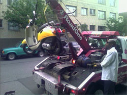 Militant motorists have recently been taking extreme measures to move scooters, mounting cranes like this to the back of their vehicles. This is now illegal. Militant motorists have recently been taking extreme measures to move scooters, mounting cranes like this to the back of their vehicles. This is now illegal.